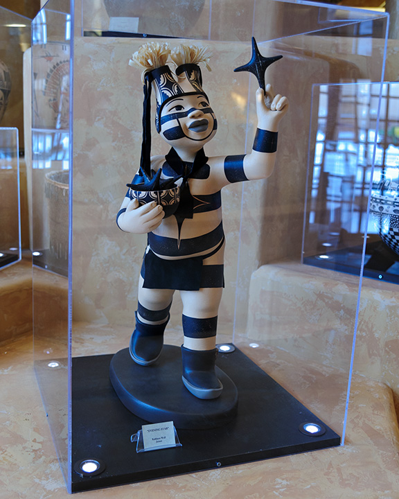 Kathleen Wall (Jemez) ceramic koshare sculpture inside a display case in the lobby of the Buffalo Thunder Hilton Resort Hotel on Pojoaque Pueblo in Santa Fe, New Mexico.